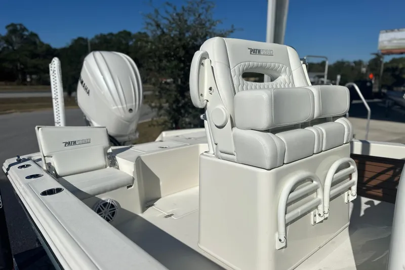 Slide: The Image of Pathfinder 2500 Hybrid 2026 boat interior with white cushioned seating and Yamaha engine. - 13