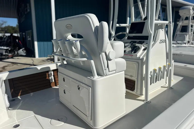 Slide: The Image of 2026 Pathfinder 2500 Hybrid boat interior with helm and seating area. - 14