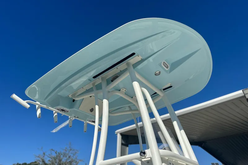 Slide: The Image of 2026 Pathfinder 2500 Hybrid boat underside against clear blue sky. - 16