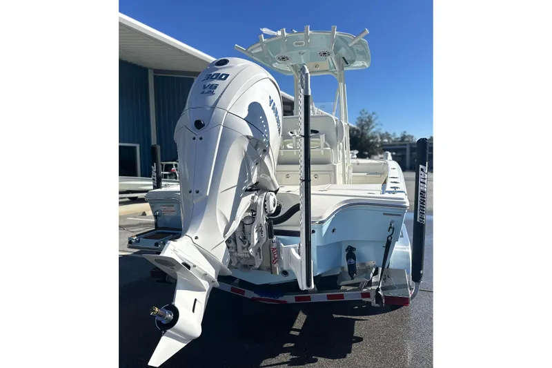 Slide: The Image of 2026 Pathfinder 2500 Hybrid boat with Yamaha V6 engine, docked outdoors. - 21