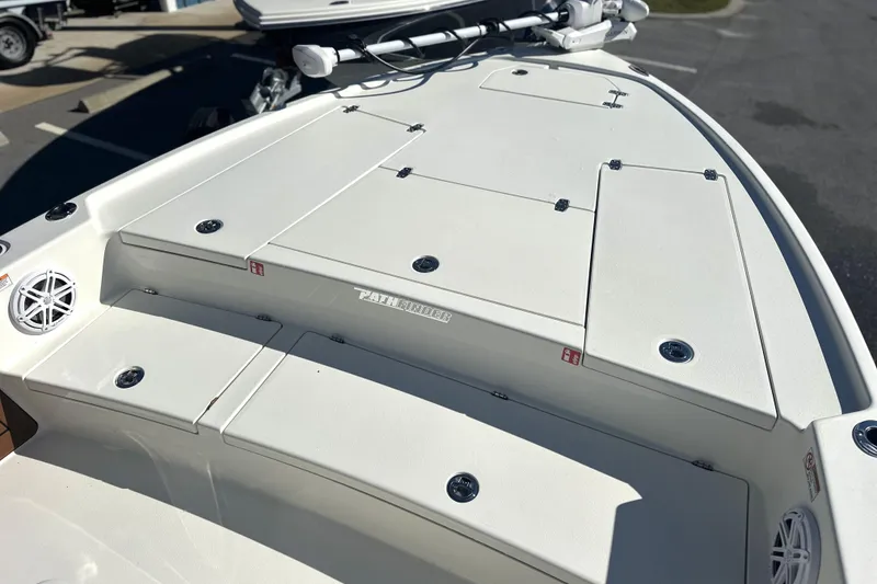 Slide: The Image of 2026 Pathfinder 2500 Hybrid boat deck with storage compartments and speakers. - 5