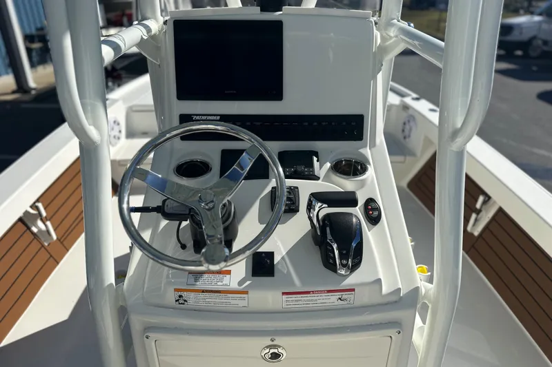 Slide: The Image of 2026 Pathfinder 2500 Hybrid boat console with steering wheel and controls. - 9