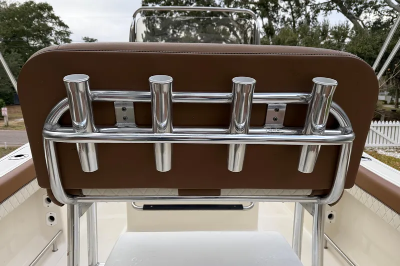Slide: The Image of 2021 Pioneer 202 Islander boat with stainless steel rod holders and brown seating. - 18