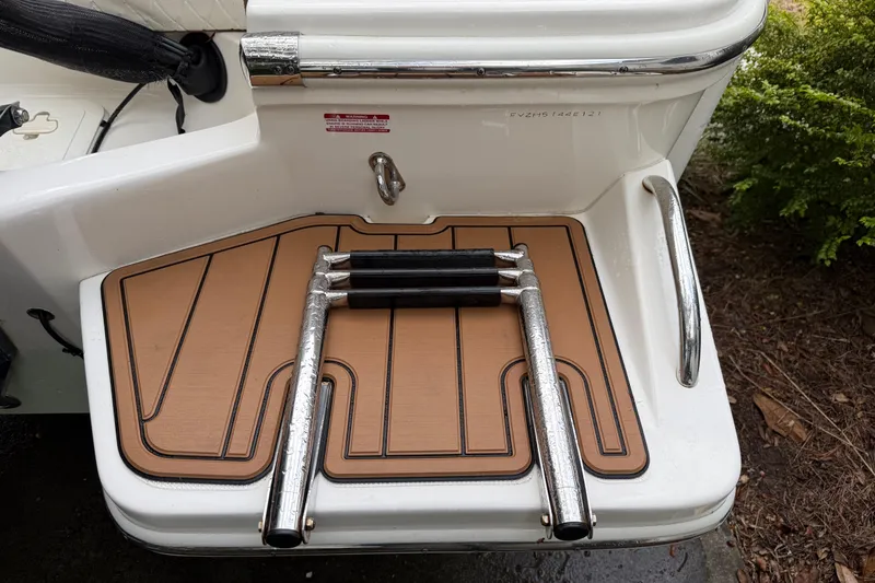 Slide: The Image of 2021 Pioneer 202 Islander swim platform with foldable ladder and teak-style decking. - 29