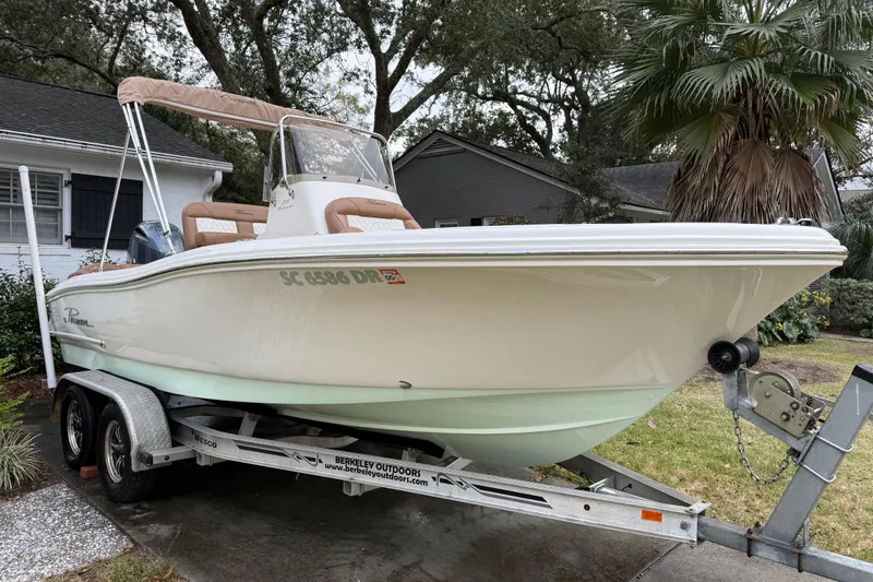 Slide: The Image of 2021 Pioneer 202 Islander boat on trailer, parked in residential driveway. - 3