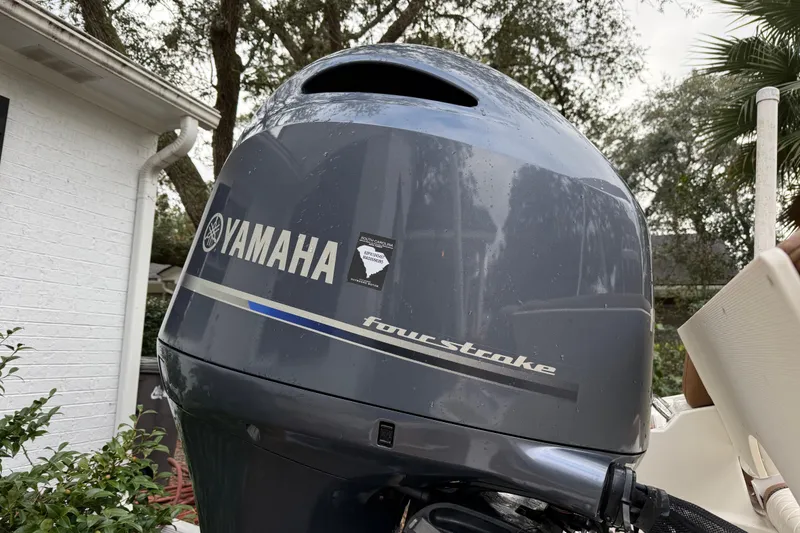 Slide: The Image of Yamaha four-stroke engine on 2021 Pioneer 202 Islander boat, outdoor setting. - 7