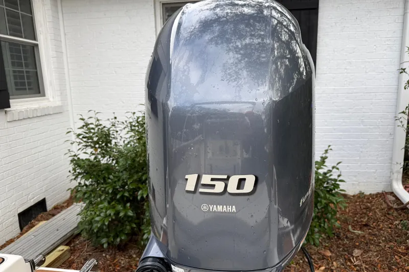 Slide: The Image of Yamaha 150 outboard motor on 2021 Pioneer 202 Islander boat, exterior view. - 8