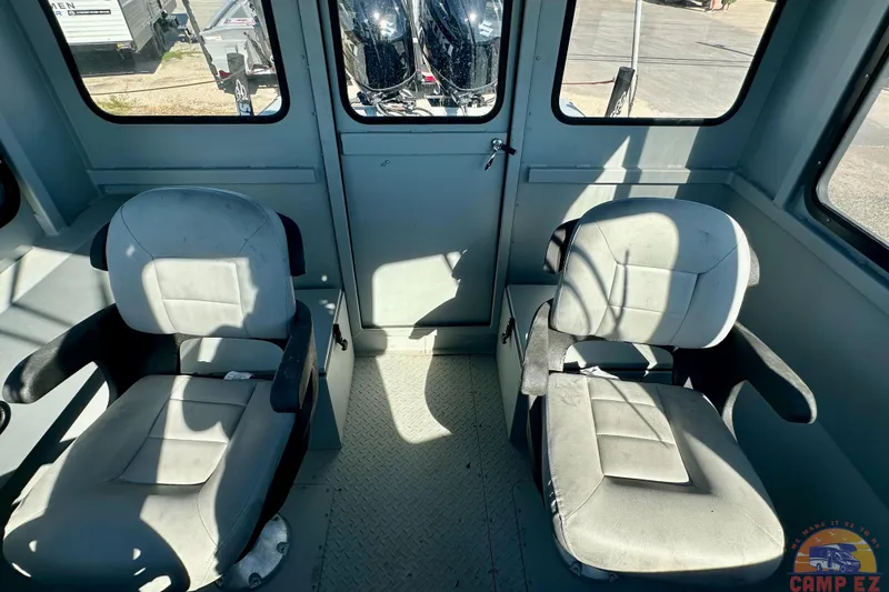 Slide: The Image of Interior of 2024 SeaArk 2672 Workhorse boat with two cushioned seats. - 11