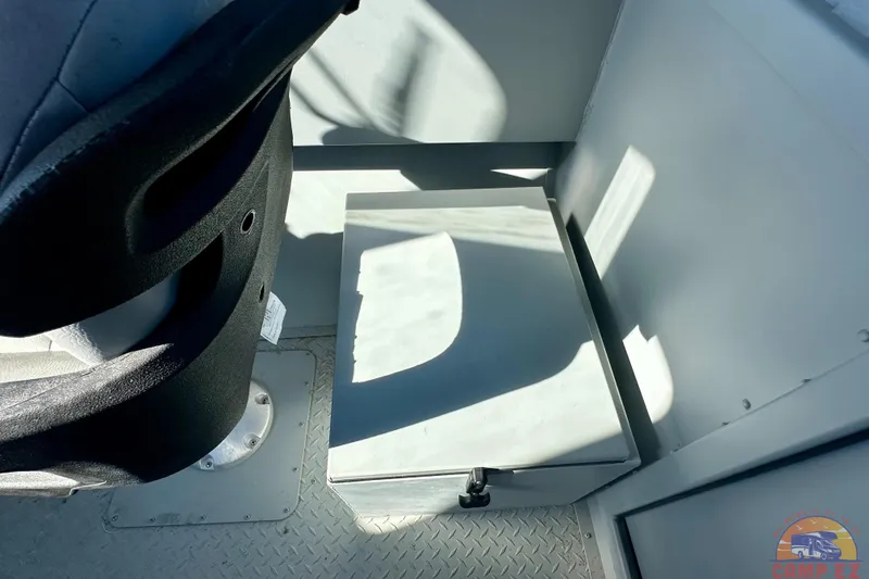 Slide: The Image of Interior of 2024 SeaArk 2672 Workhorse boat, featuring a storage compartment and seat. - 14