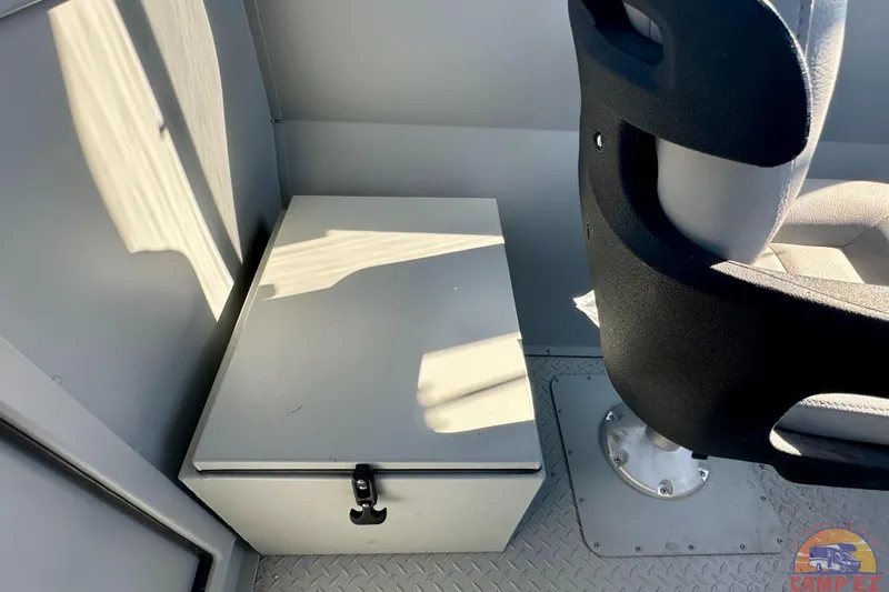 Slide: The Image of 2024 SeaArk 2672 Workhorse interior with storage box and seat. - 15