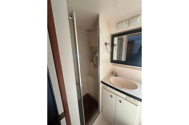 Slide: The Image of Bathroom interior of 2000 Silverton 38 yacht with sink and shower. - 17