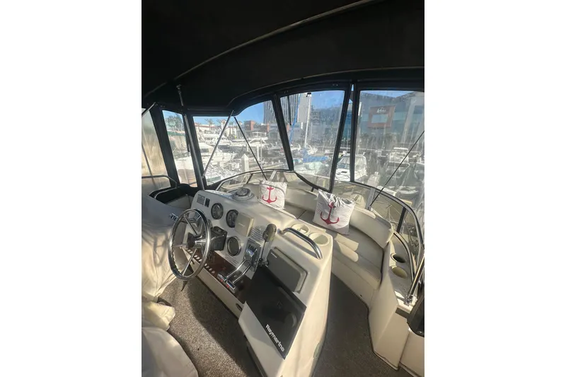 Slide: The Image of Interior view of 2000 Silverton 38 yacht helm with steering wheel and gauges. - 5