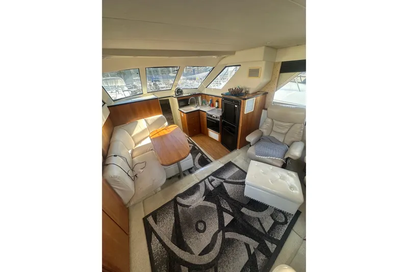 Slide: The Image of Luxurious interior of a 2000 Silverton 38 yacht with plush seating and modern amenities. - 8