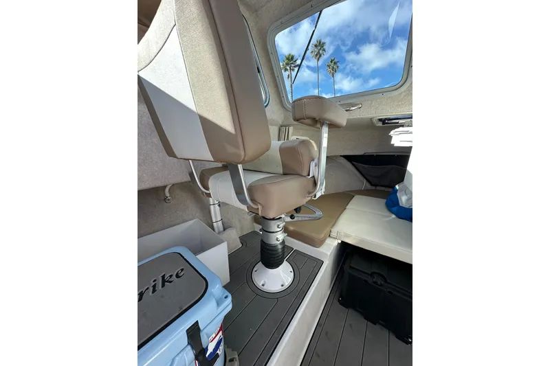 Slide: The Image of Interior of 2020 Parker 2320 Sport Cabin with seating and window view. - 19