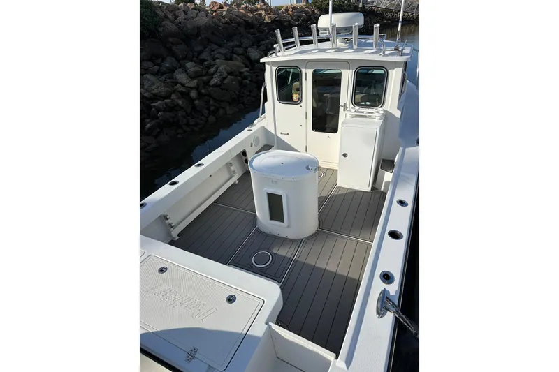 Slide: The Image of 2020 Parker 2320 Sport Cabin boat with spacious deck and modern design. - 7