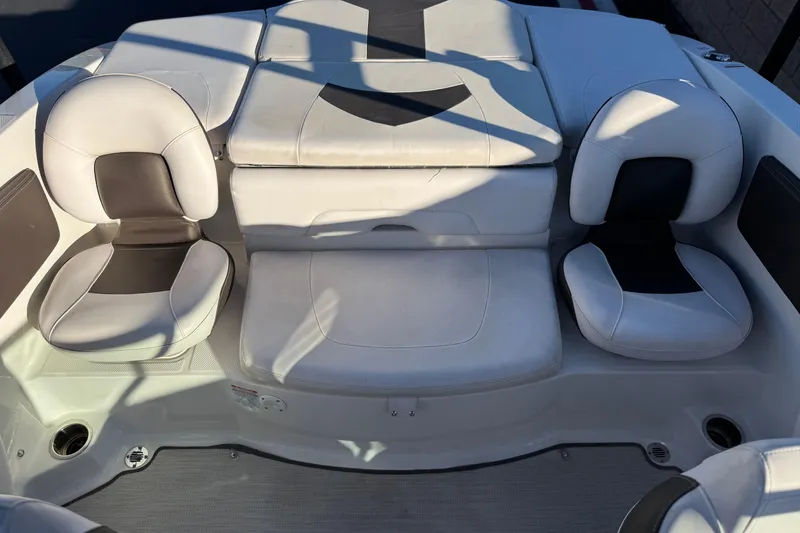 Slide: The Image of 2019 Chaparral 21 H2O Ski & Fish boat interior with cushioned seating. - 17