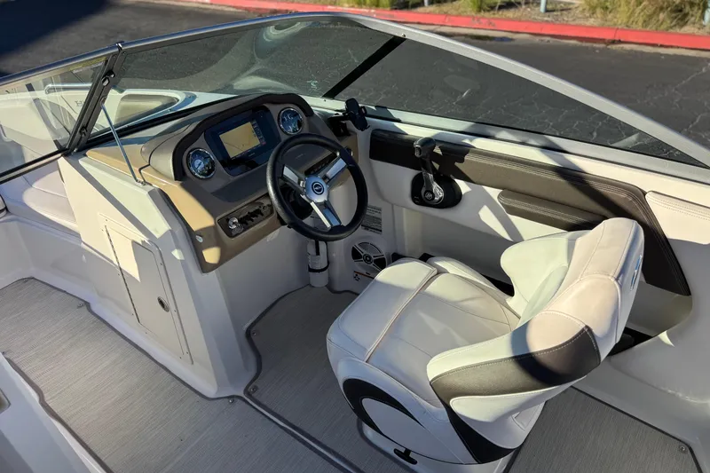 Slide: The Image of 2019 Chaparral 21 H2O Ski & Fish boat interior with steering wheel and dashboard. - 27