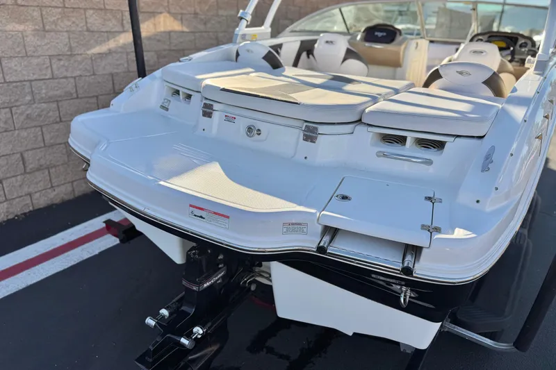 Slide: The Image of 2019 Chaparral 21 H2O Ski & Fish boat, rear view, parked on trailer. - 6