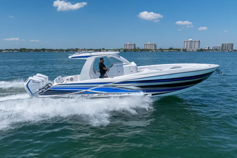 The Image of 2026 Deep Impact 369 Sport boat cruising on water. - 0