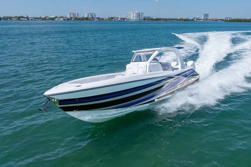 Slide: The Image of 2026 Deep Impact 369 Sport boat cruising on water. - 11