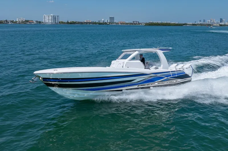 Slide: The Image of 2026 Deep Impact 369 Sport boat cruising on water. - 13