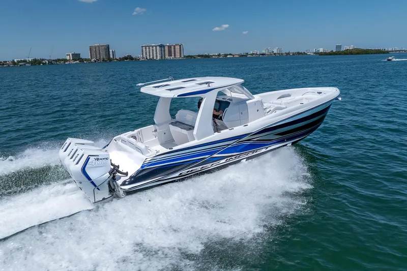 Slide: The Image of 2026 Deep Impact 369 Sport boat cruising on water. - 2