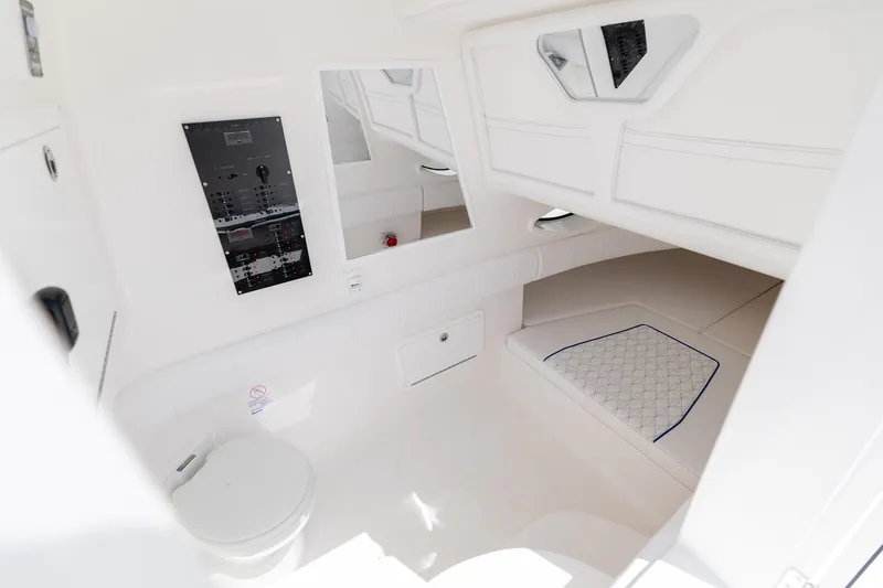 Slide: The Image of Interior of Deep Impact 369 Sport 2026 with toilet and control panel. - 28