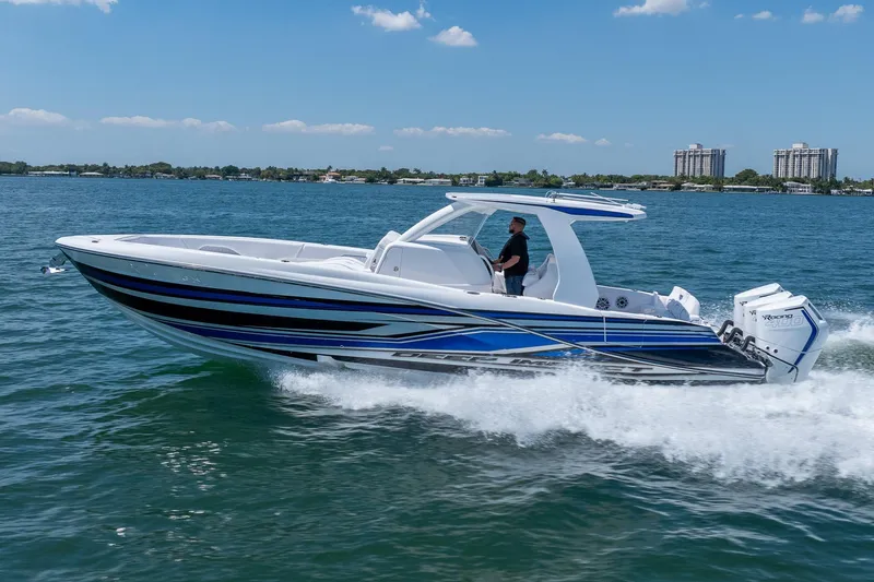 Slide: The Image of 2026 Deep Impact 369 Sport boat cruising on water. - 32