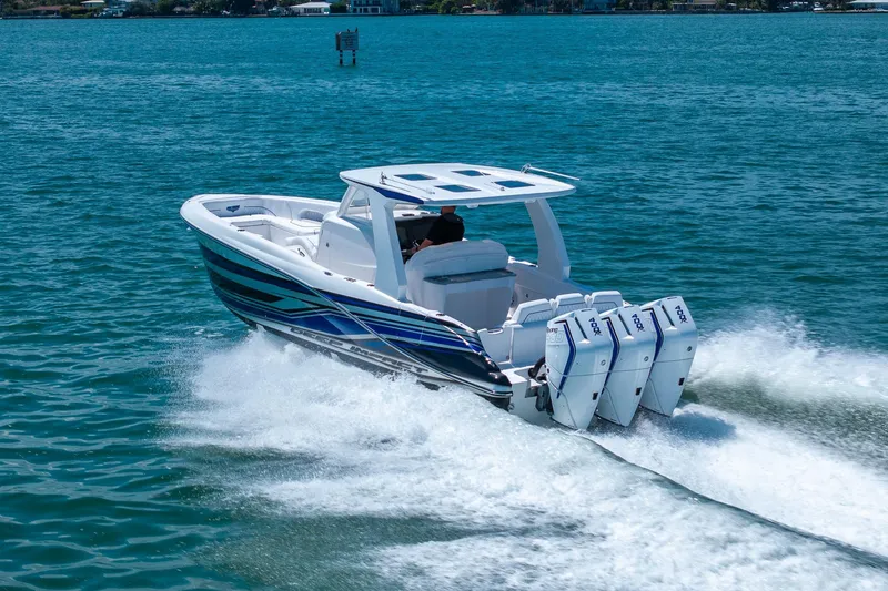 Slide: The Image of Deep Impact 369 Sport 2026 boat on water with four engines. - 33