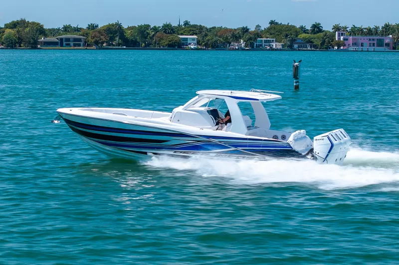 Slide: The Image of 2026 Deep Impact 369 Sport boat on blue water. - 34