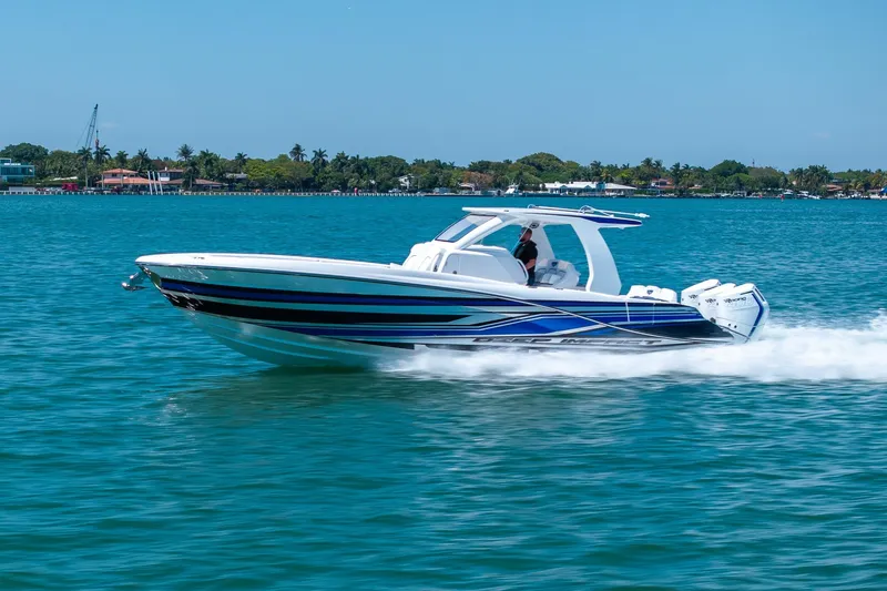 Slide: The Image of 2026 Deep Impact 369 Sport boat cruising on water. - 35