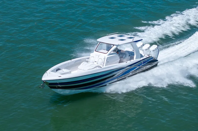 Slide: The Image of 2026 Deep Impact 369 Sport boat cruising on water. - 38