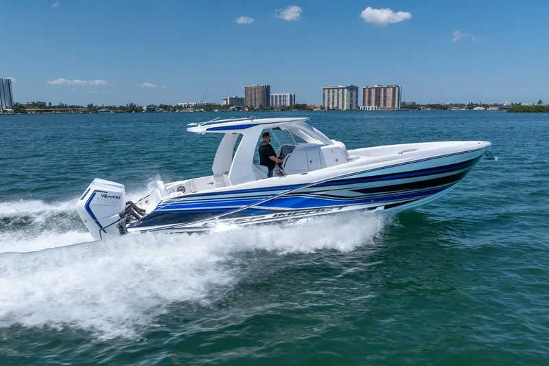 Slide: The Image of 2026 Deep Impact 369 Sport boat cruising on the water. - 5