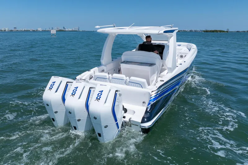 Slide: The Image of 2026 Deep Impact 369 Sport boat on open water. - 7