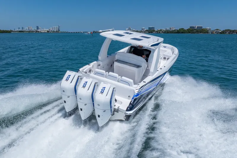 Slide: The Image of 2026 Deep Impact 369 Sport boat cruising on water. - 8