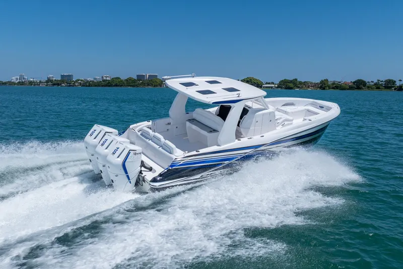 Slide: The Image of 2026 Deep Impact 369 Sport boat cruising on water. - 9