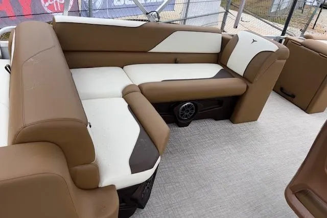 Slide: The Image of Luxurious seating on 2026 Tahoe Pontoon SP 2180 CRB with brown and white upholstery. - 10