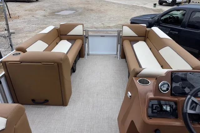 Slide: The Image of 2026 Tahoe Pontoon SP 2180 CRB interior with tan and white seating, dashboard view. - 11