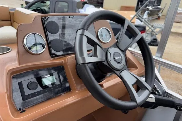 Slide: The Image of Steering console of 2026 Tahoe Pontoon SP 2180 CRB with modern controls and gauges. - 12