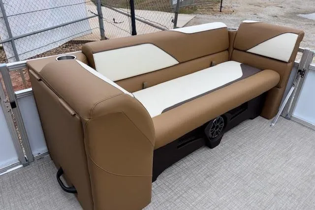 Slide: The Image of 2026 Tahoe Pontoon SP 2180 CRB boat seating, brown and white upholstery, outdoor setting. - 14