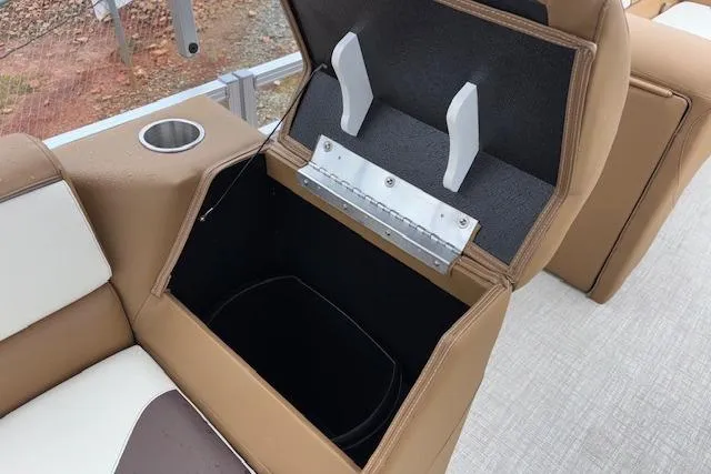 Slide: The Image of 2026 Tahoe Pontoon SP 2180 CRB storage compartment with cup holder and cushioned seating. - 16