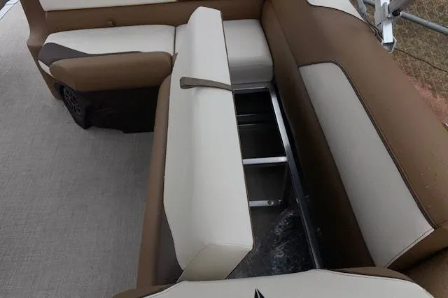 Slide: The Image of 2026 Tahoe Pontoon SP 2180 CRB interior seating with storage compartment open. - 17