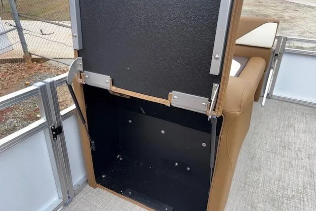Slide: The Image of Open storage compartment on 2026 Tahoe Pontoon SP 2180 CRB boat, featuring brown seating. - 20