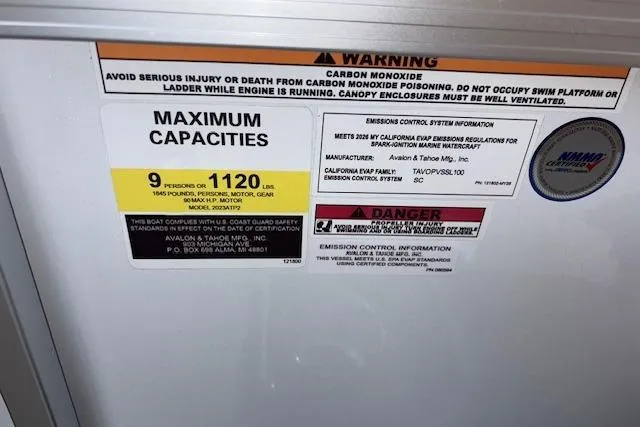 Slide: The Image of Warning labels and capacity information on a 2026 Tahoe Pontoon SP 2180 CRB boat. - 21