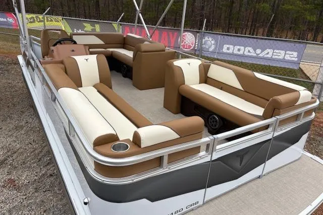 Slide: The Image of 2026 Tahoe Pontoon SP 2180 CRB with brown and white seating, displayed outdoors. - 5