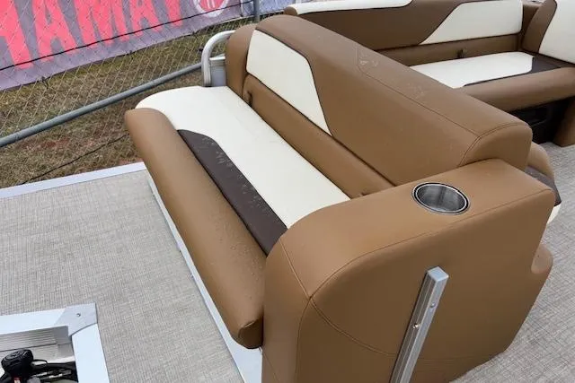 Slide: The Image of 2026 Tahoe Pontoon SP 2180 CRB with tan and cream seating, featuring a cup holder. - 9