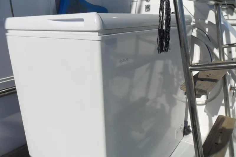Slide: The Image of White Vissani freezer on 1979 Bertram 46.6 Sport Fisher boat deck. - 11