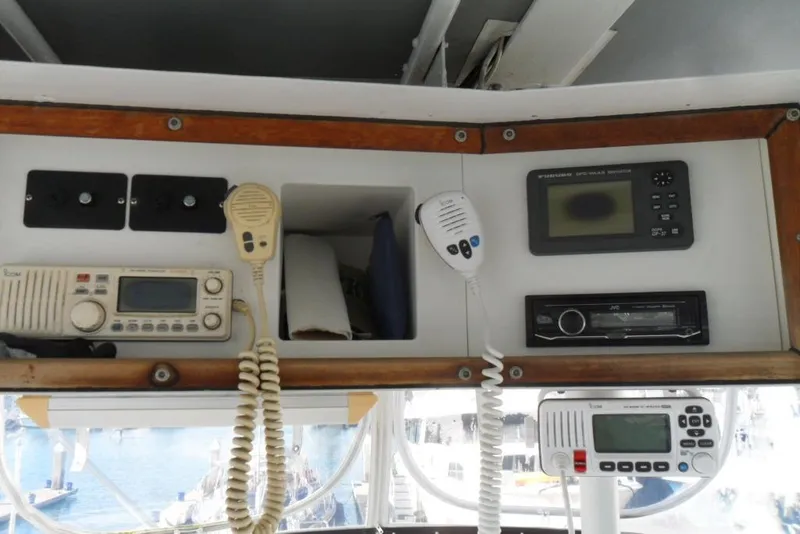 Slide: The Image of 1979 Bertram 46.6 Sport Fisher cockpit with communication and navigation equipment. - 17