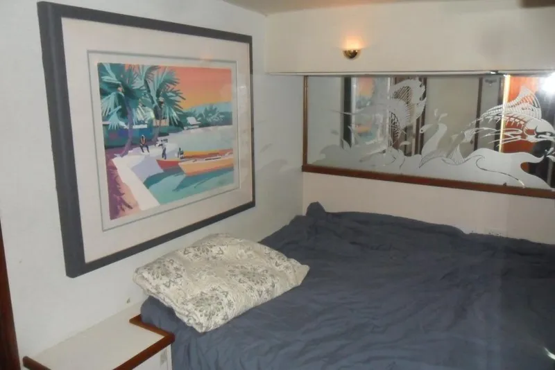 Slide: The Image of Interior of 1979 Bertram 46.6 Sport Fisher with artwork and bed. - 30