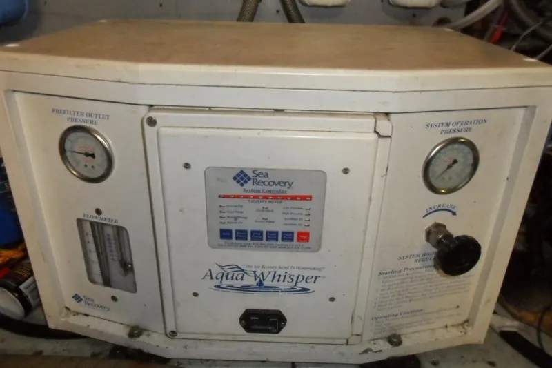 Slide: The Image of Sea Recovery Aqua Whisper watermaker control panel on a 1979 Bertram 46.6 Sport Fisher. - 34